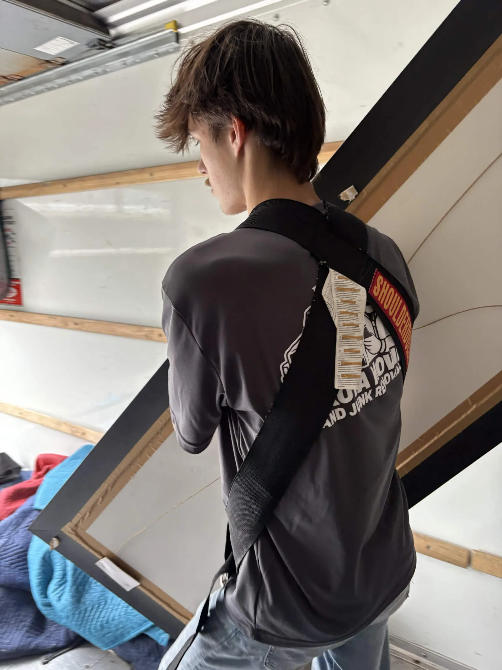 A Dakota mover handling furniture inside a moving truck.